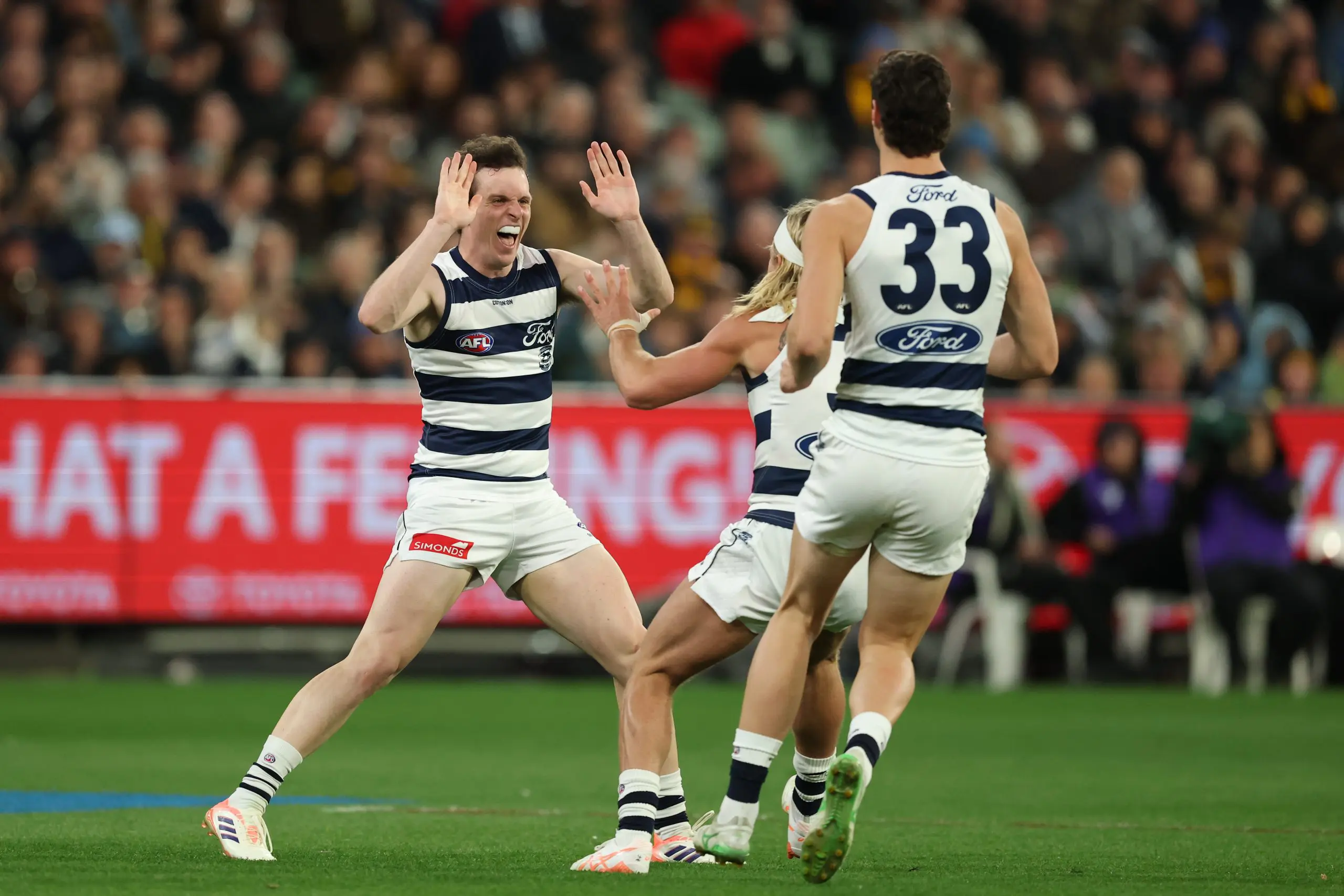 MELBOURNE, AUSTRALIA - SEPTEMBER 19: Max Holmes of the Cats celebrates a goal during the AFL Preliminary Final match between Geelong Cats and Hawthorn Hawks at Melbourne Cricket Ground on September 19, 2025 in Melbourne, Australia. (Photo by Robert Cianflone/Getty Images)