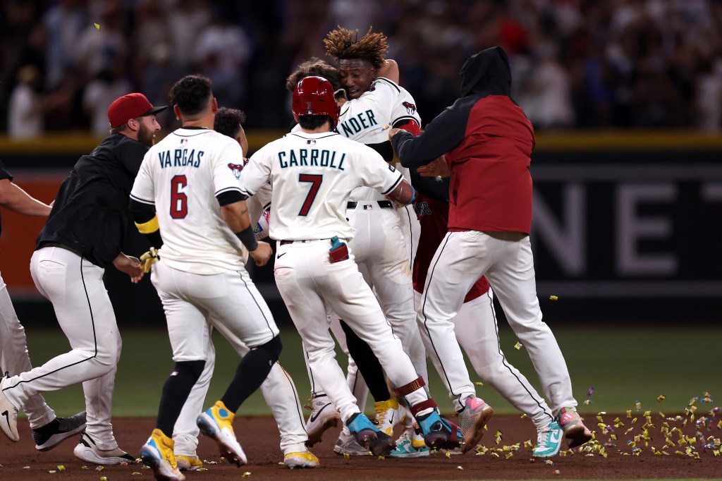 Arizona Diamondbacks players celebrate a win against the Los Angeles Dodgers.