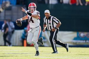 JACKSONVILLE, FL - NOVEMBER 01: Georgia Bulldogs quarterback Gunner Stockton (14) looks for a receiver during the game between the Florida Gators and the Georgia Bulldogs on November 1, 2025 at EverBank Field in Jacksonville, Fl. (Photo by David Rosenblum/Icon Sportswire via Getty Images)