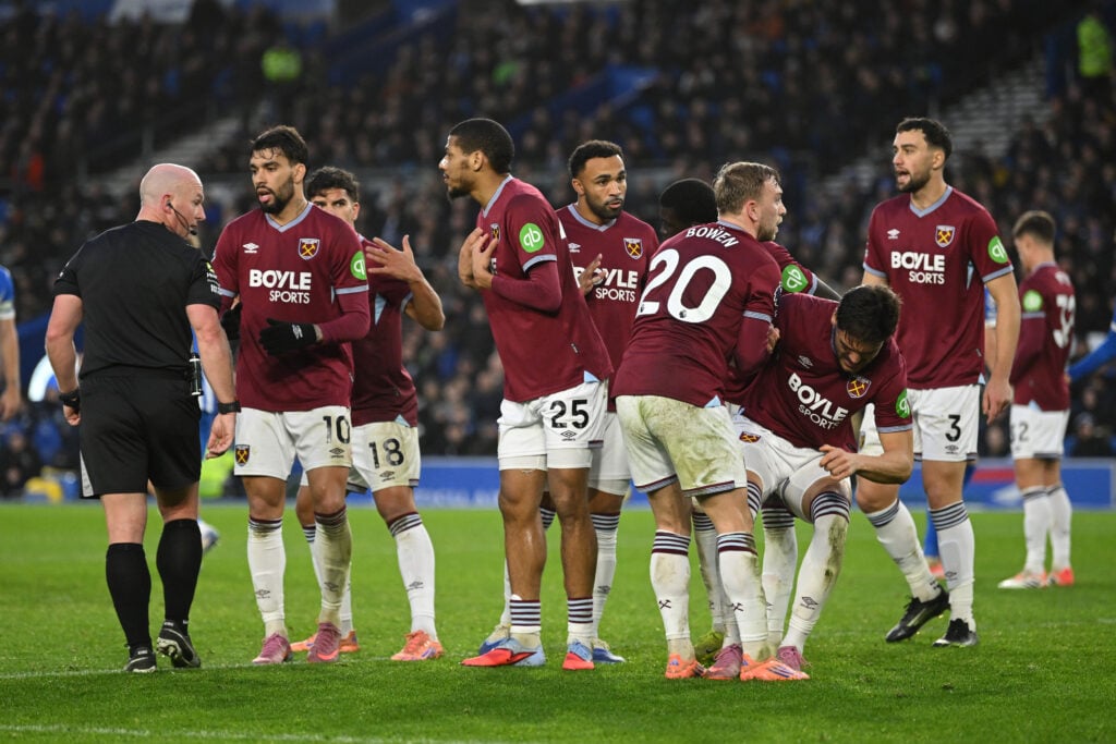 Lucas Paqueta and Jean-Clair Todibo of West Ham make a point to referee Simon Hooper