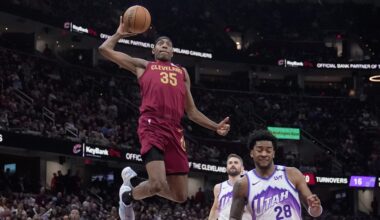 Nae'qwan Tomlin goes up for a dunk.