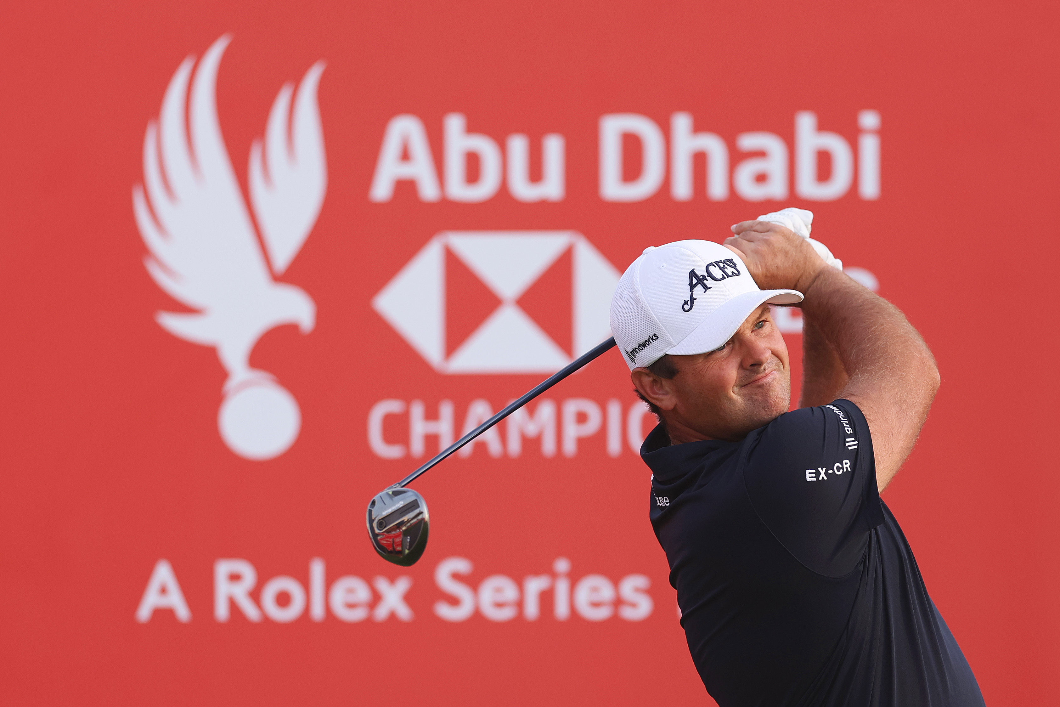 Patrick Reed hits a fairway wood