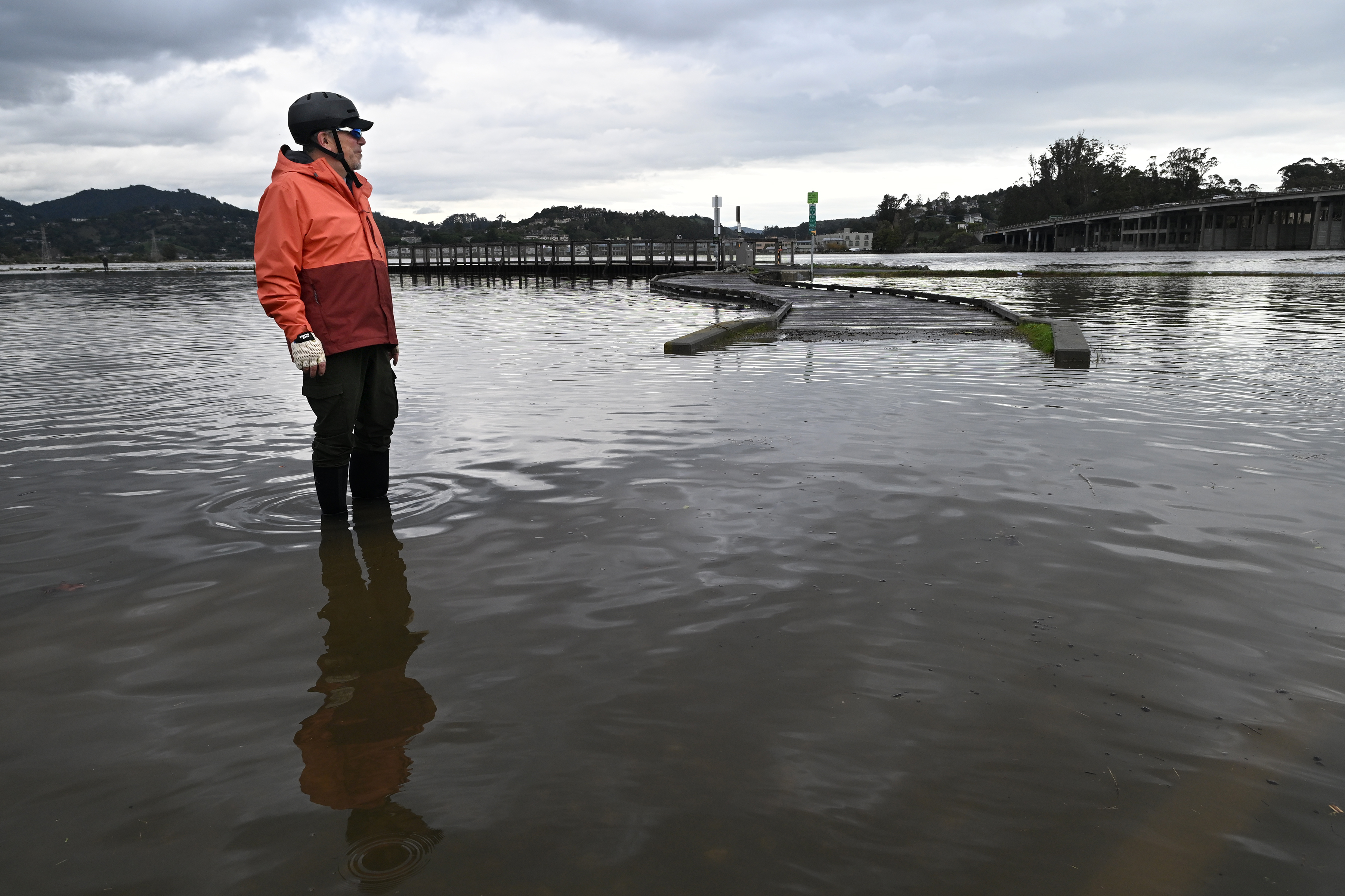 Jamie Lease of Mill Valley stands on the submerged San...
