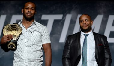 Daniel Cormier and Jon Jones pose on stage after a UFC press conference