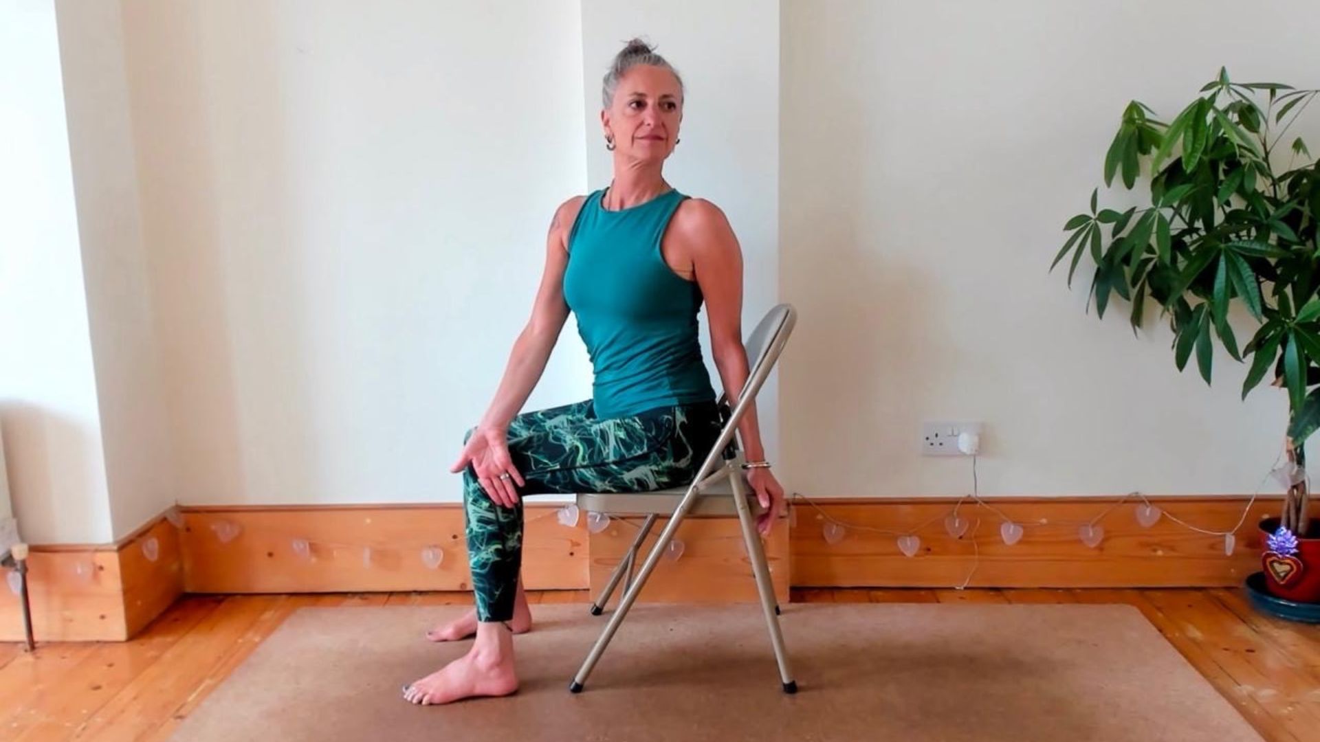 Dina Cohen demonstrates the seated spine twist