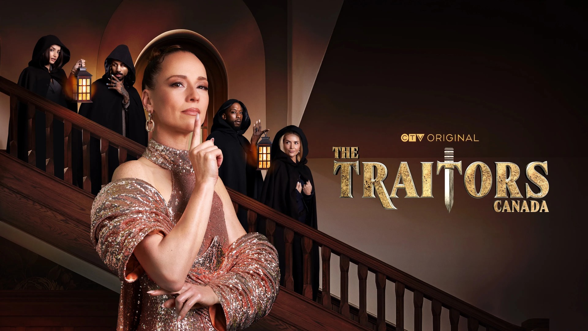 Promotional poster for "The Traitors Canada" featuring host Karine Vanasse in a shimmering gown holding a finger to her lips, while four hooded figures with lanterns stand on a staircase behind her.
