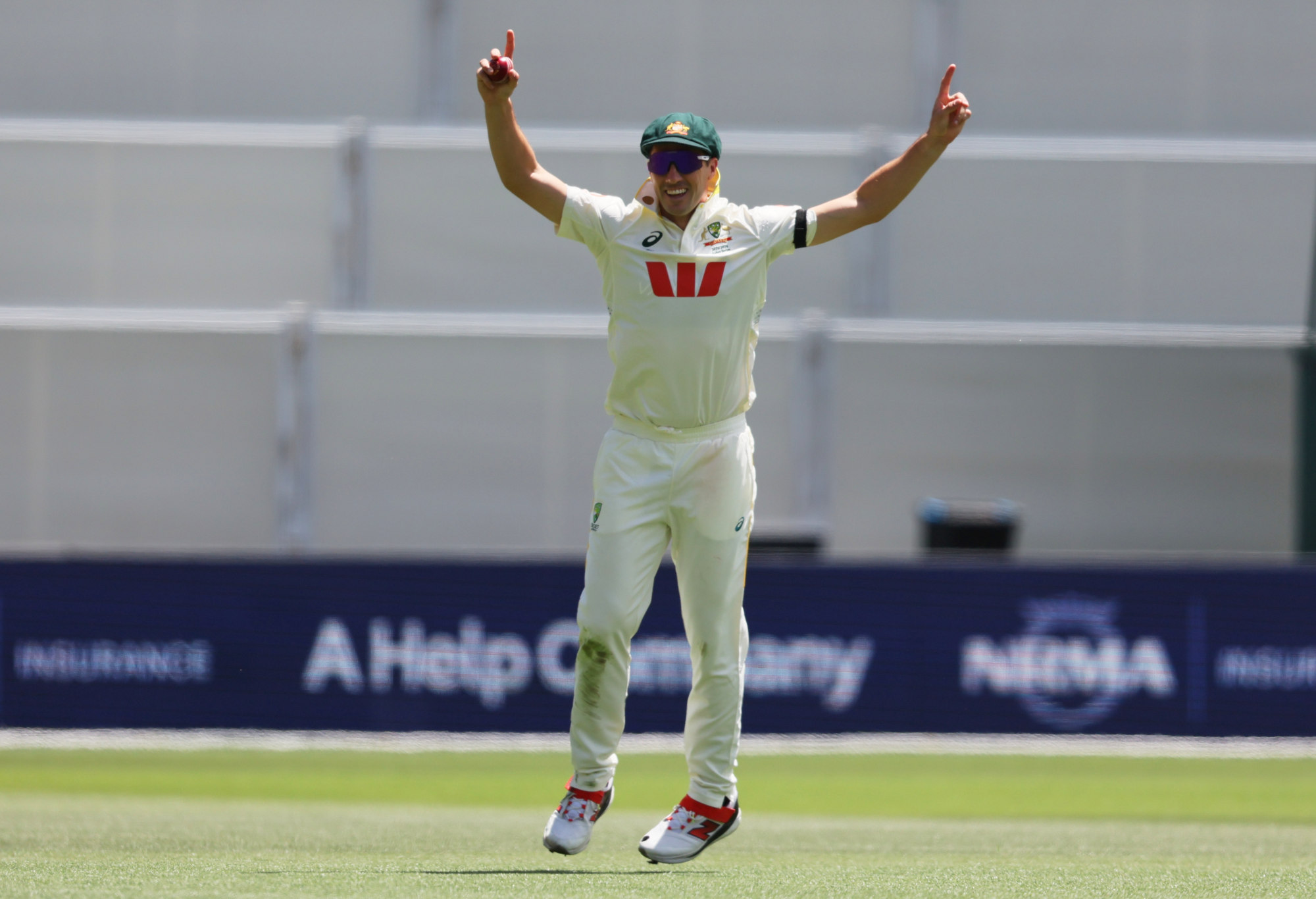 Pat Cummins reacts after taking a catch to dismiss Jamie Smith.
