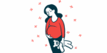 A pregnant woman holds her belly and a teddy bear.