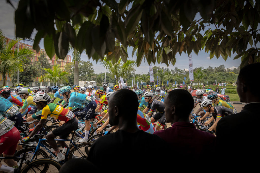 The pack rides during the last stage of the 16th Tour du Rwanda in Kigali on February 25, 2024. (Photo by Guillem Sartorio / AFP)