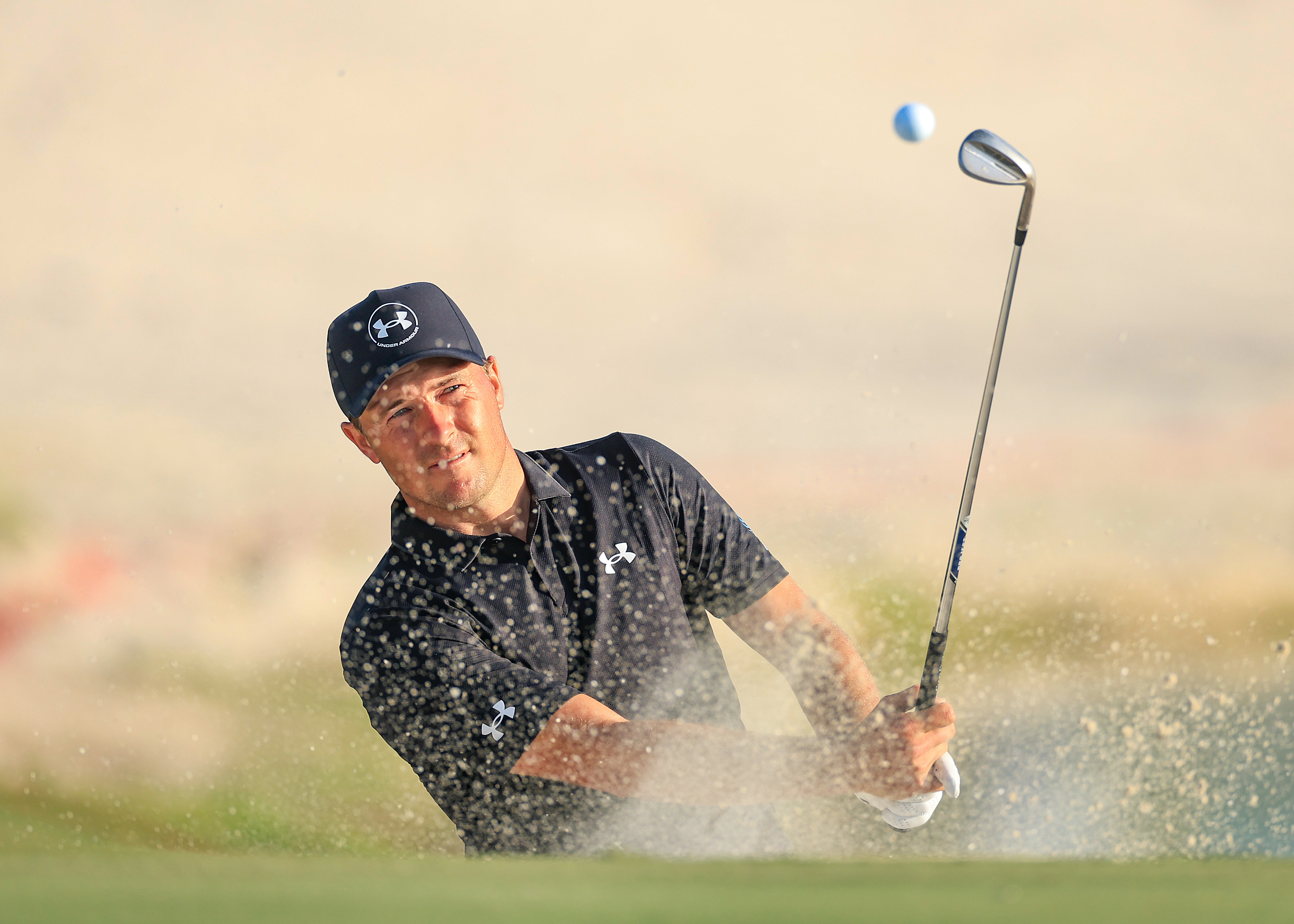 Jordan Spieth hits a bunker shot