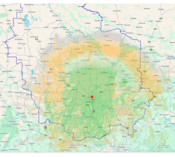 Map showing the geographic area around Canberra, Australia, highlighting elevation changes with green and orange shades. The red marker indicates a specific location within the mapped region.