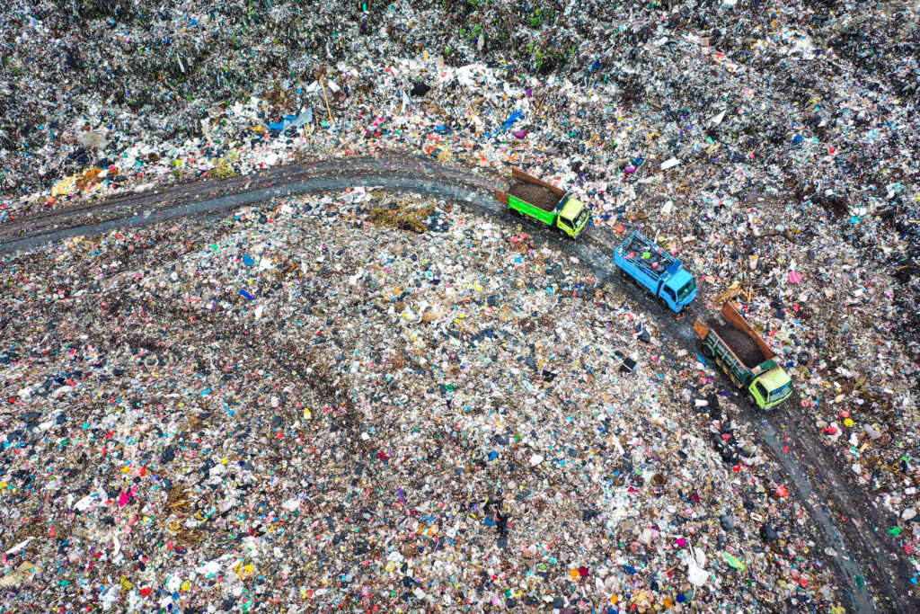 trucks in a giant landfill
