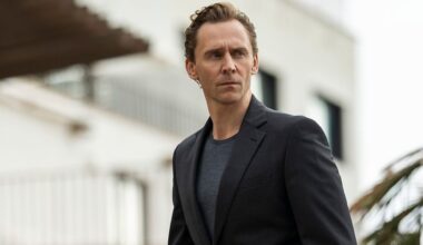 Tom Hiddleston looks at something off camera