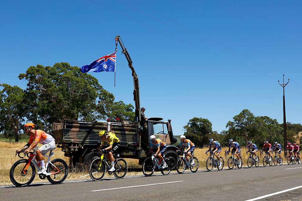 NAIRNE, AUSTRALIA - JANUARY 23: (L-R) Lucas Hamilton of Australia and Team INEOS Grenadiers, Menno Huising of Netherlands and Team Visma | Lease a Bike and a general view of the peloton competing during the 26th Santos Tour Down Under 2026, Stage 3 a 140.8km stage from Henley Beach to Nairne / #UCIWT / on January 23, 2026 in Nairne, Australia. (Photo by Con Chronis/Getty Images)