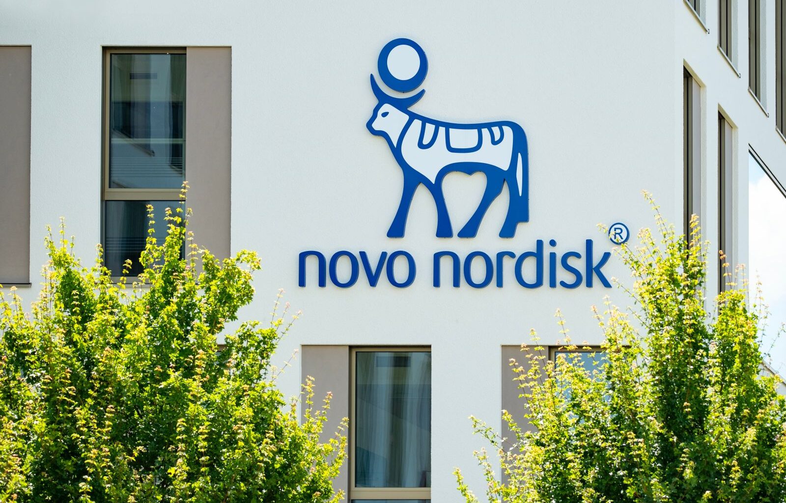 The Novo Nordisk logo on a corporate building by Kittyfly via Shutterstock