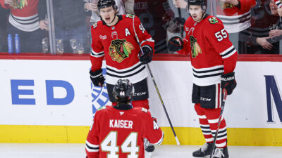 Nov 18, 2025; Chicago, Illinois, USA; Chicago Blackhawks center Connor Bedard (98) celebrates with teammates after scoring against the Calgary Flames during the third period at United Center. Mandatory Credit: Kamil Krzaczynski-Imagn Images