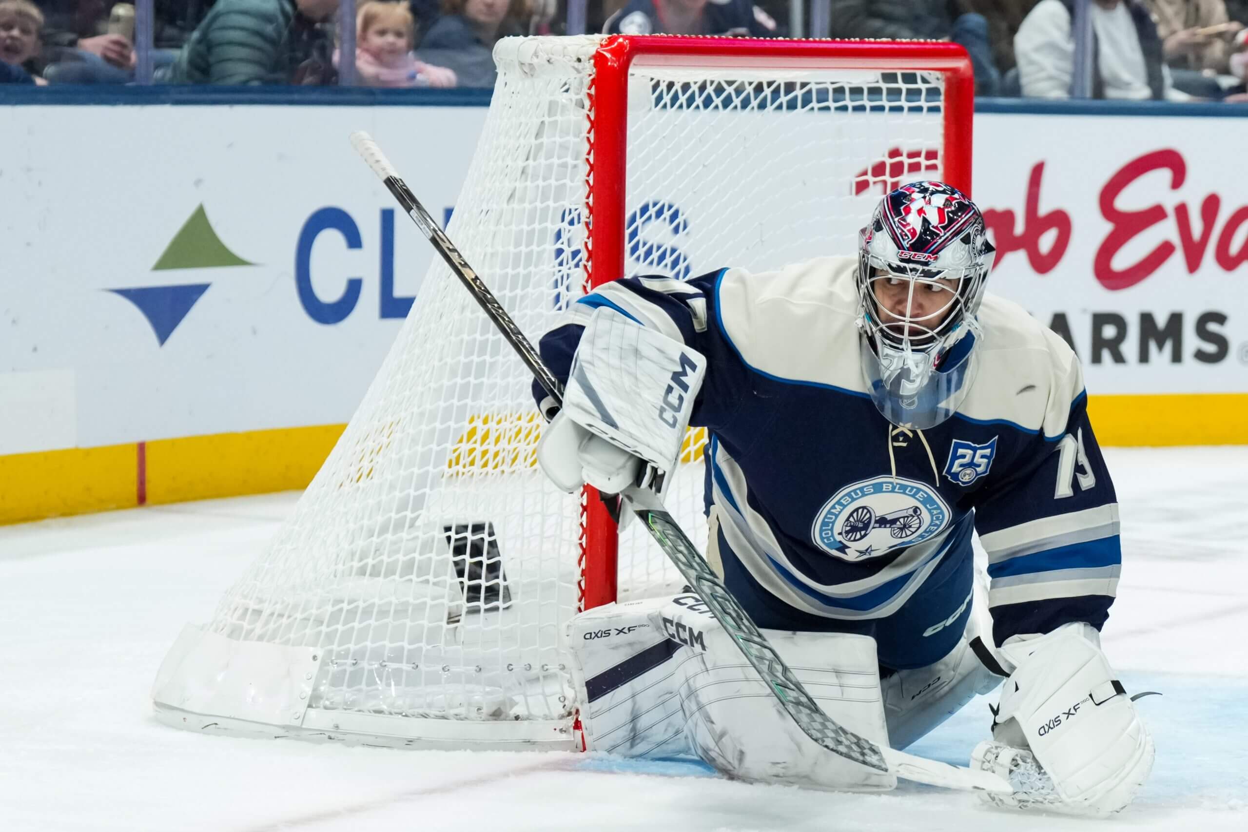 Jet Greaves braces against the side of the Blue Jackets net.