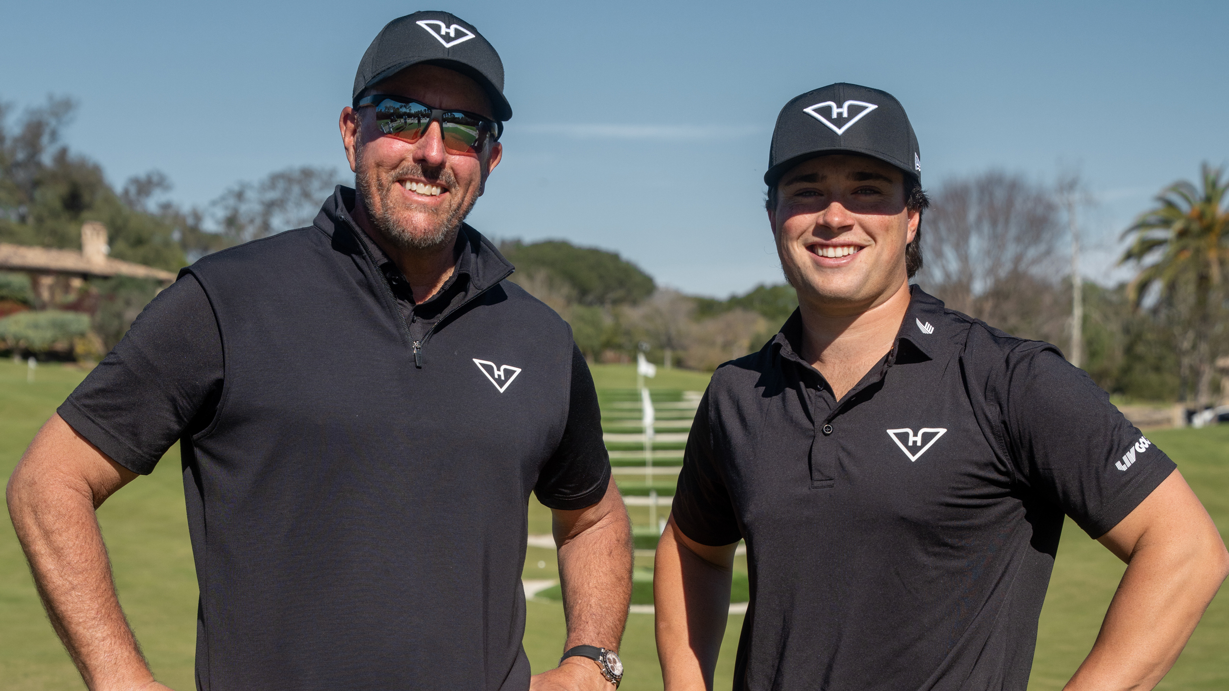 Michael La Sasso with Phil Mickelson after signing for LIV Golf