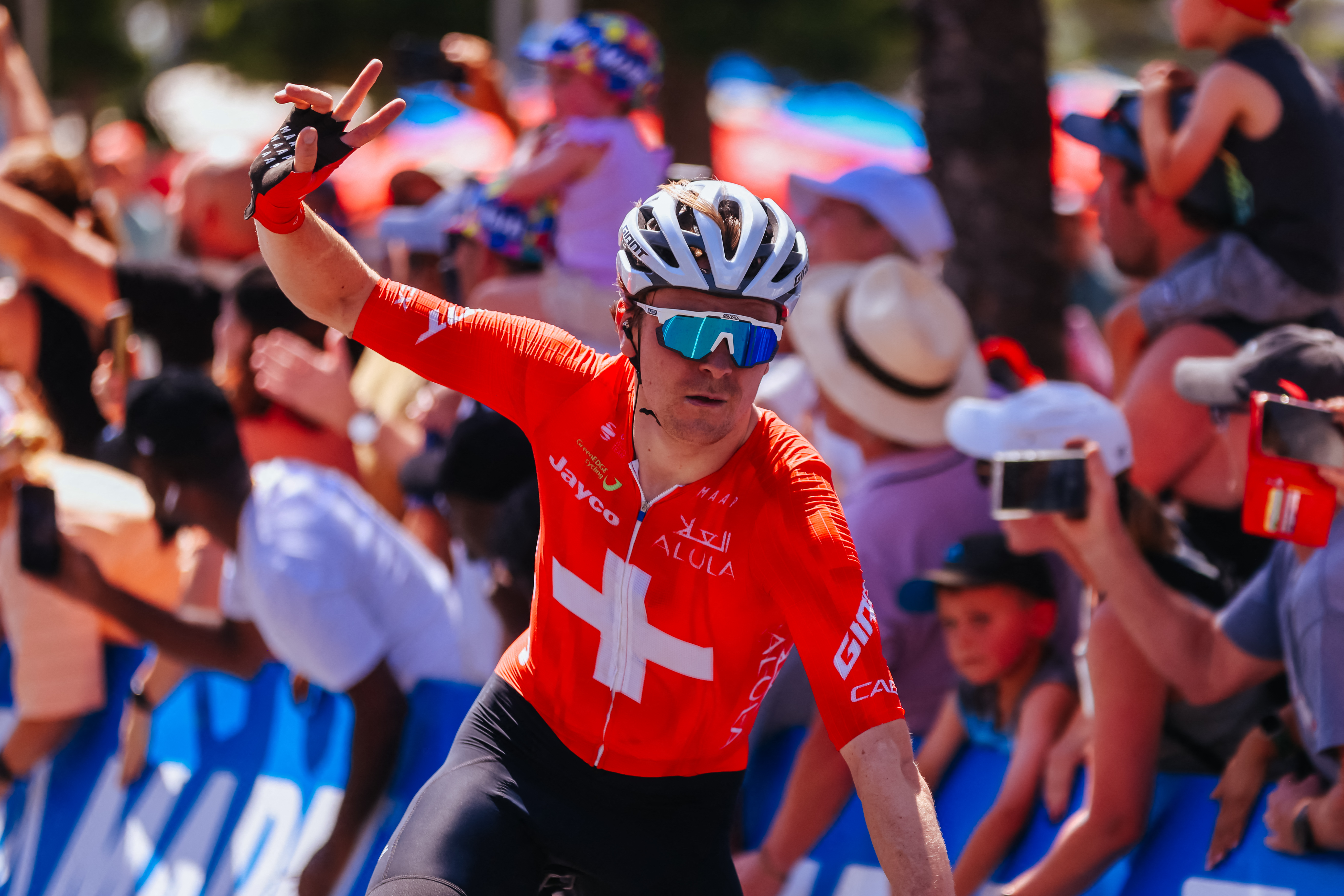 Switzerland's Mauro Schmid of Team Jayco Alula crosses the line to win the 2025 Cadel Evans Great Ocean Men's Elite Road Race in Geelong on February 2, 2025. (Photo by CHRIS PUTNAM / AFP) / -- IMAGE RESTRICTED TO EDITORIAL USE - STRICTLY NO COMMERCIAL USE -- (Photo by CHRIS PUTNAM/AFP via Getty Images)