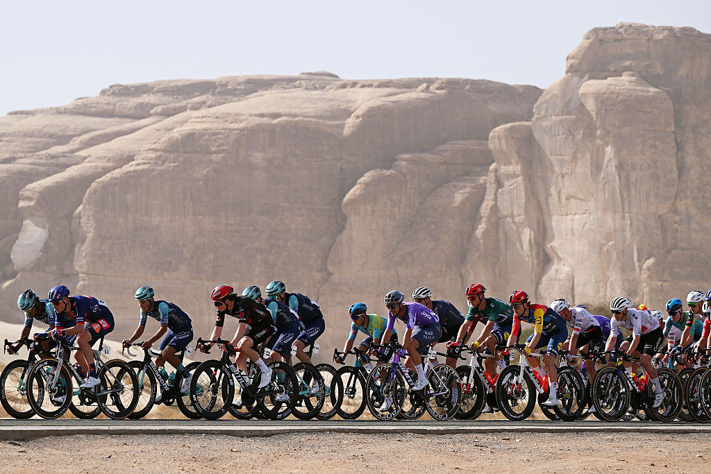 ALMANSHIYAH, SAUDI ARABIA - JANUARY 28: (L-R) Dillon Corkery of Ireland and Team Picnic PostNL, Afonso Eulalio of Portugal and Team Bahrain Victorious, Robin Froidevaux of Switzerland and Team Tudor Pro Cycling, Kamil Gradek of Poland and Team Bahrain Victorious, Yevgeniy Fedorov of Kazakhstan and XDS Astana Team, Seth Dunwoody of Ireland and Team Bahrain Victorious, Jonathan Milan of Italy and Team Lidl - Trek - Green Leader Jersey and Milan Fretin of Belgium and Team Cofidis - White Best Young Rider Jersey and a general view of the peloton competing during the 6th AlUla Tour 2026, Stage 2 a 152km stage from AlManshiyah Train Station to AlManshiyah Train Station on January 28, 2026 in AlManshiyah, Saudi Arabia. (Photo by Dario Belingheri/Getty Images)
