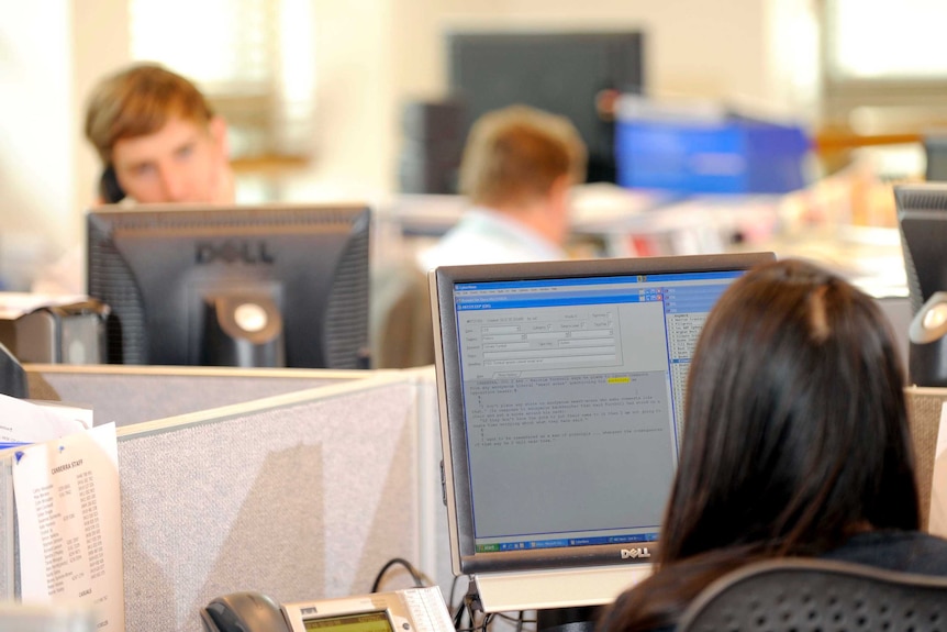 People work in an office environment.