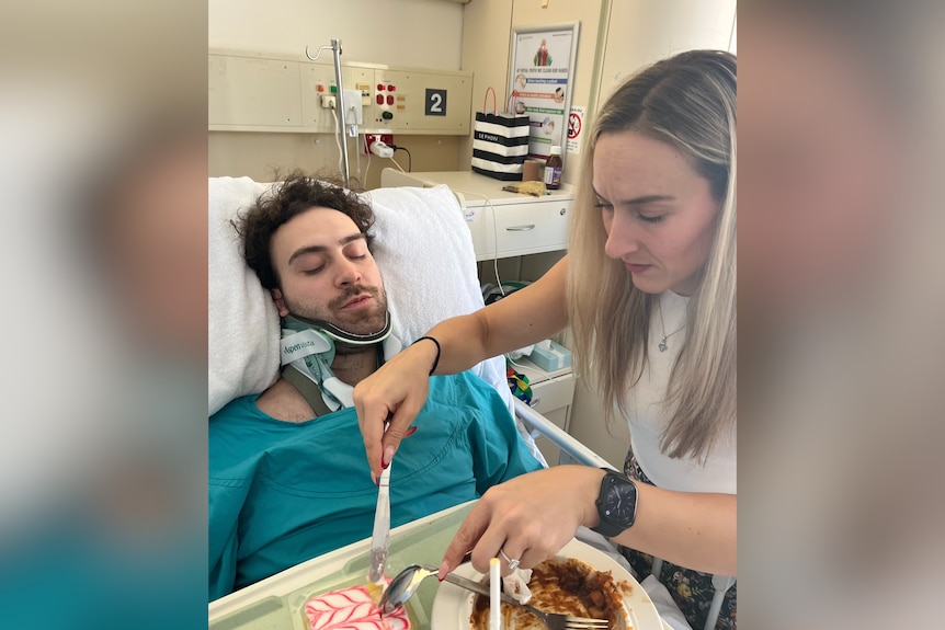 Ioannis with his cousin Aristea in hospital, she is cutting up food for him.