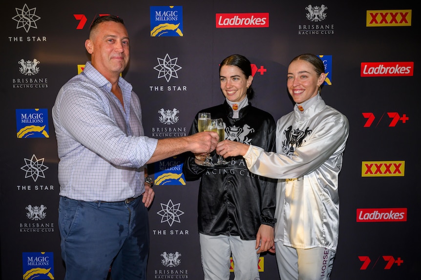 A horse trainer and two jockeys celebrate wins.