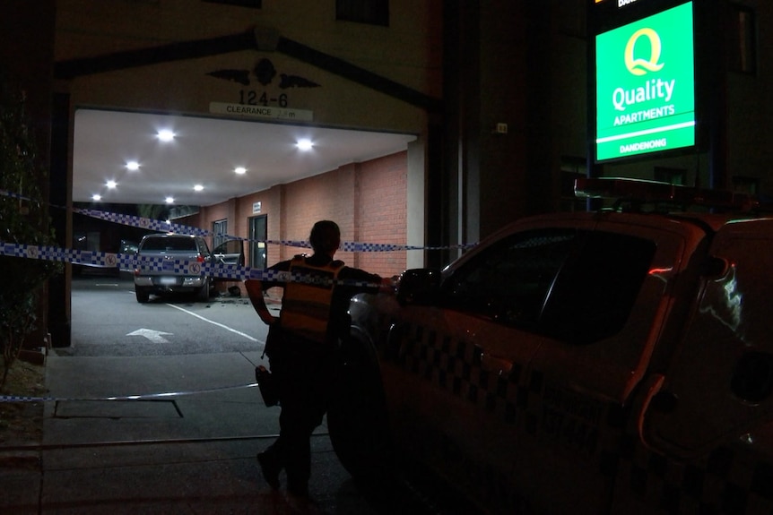 A four wheel drive with police tape around it.