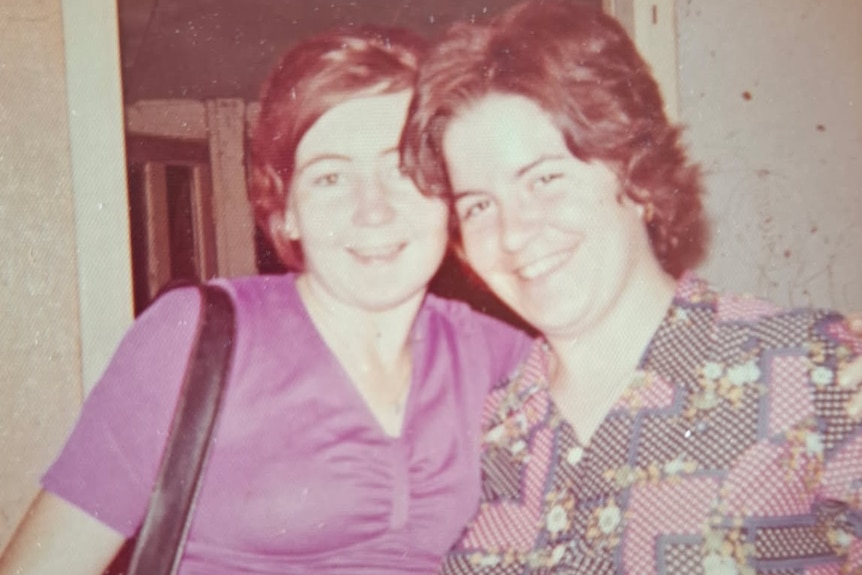 A photo of two young smiling women