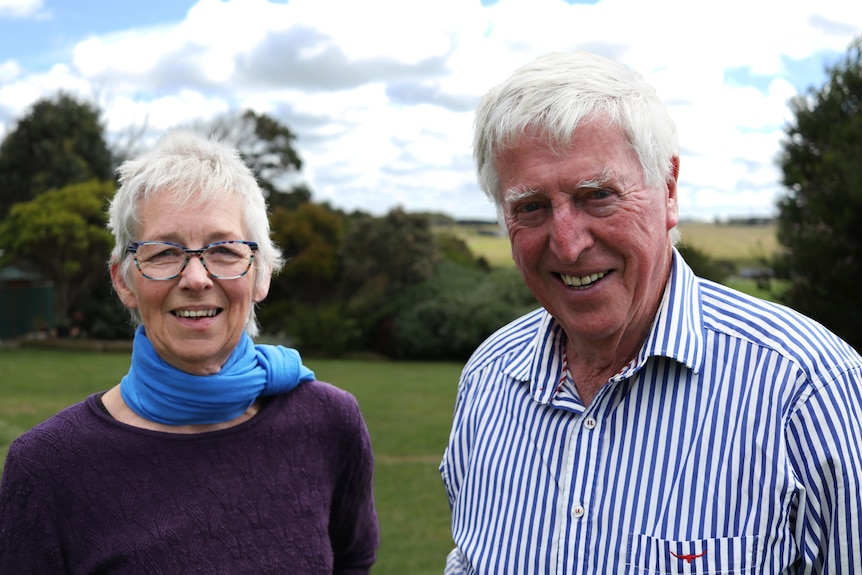 A husband and wife on a farm in their 60s and 70s