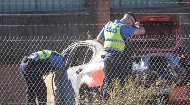 Police can be seen inspecting the car after the incident.