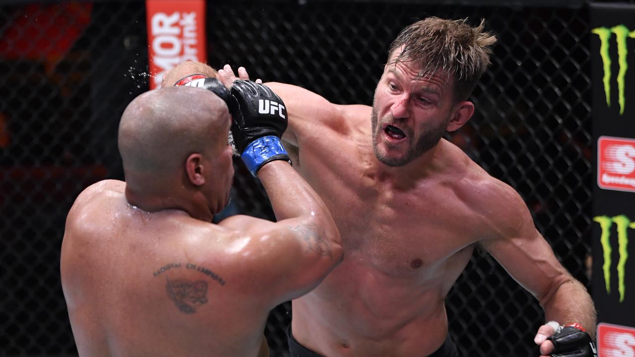 LAS VEGAS, NEVADA - AUGUST 15: In this handout image provided by UFC, Stipe Miocic (R) punches Daniel Cormier in their UFC heavyweight championship bout during the UFC 252 event at UFC APEX on August 15, 2020 in Las Vegas, Nevada. (Photo by Jeff Bottari/Zuffa LLC via Getty Images)