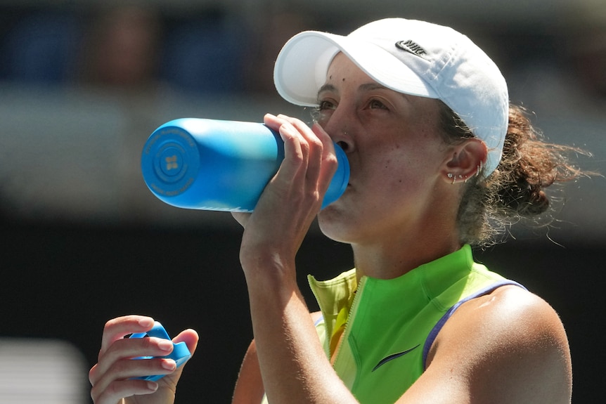 Madison Keys drinks from a water bottle at the Australian Open.