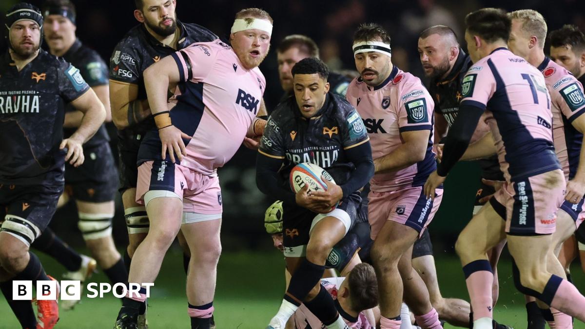 Keelan Giles of Ospreys has the ball surrounded by Cardiff players