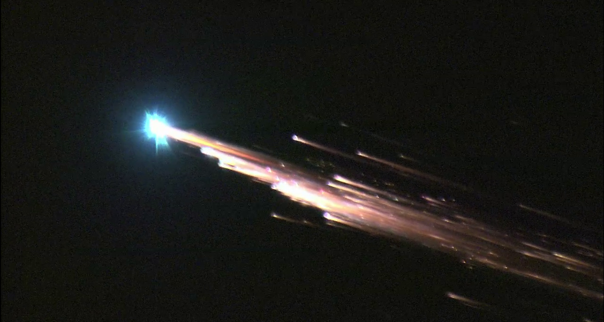 a bright fireball streaks across the sky