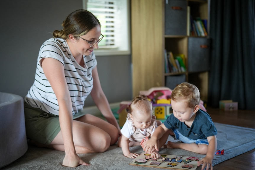 A mother and her two children. 