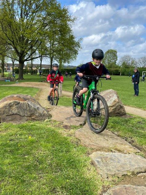 Places to Ride, Abbey Road - A group of kids riding bikes on a path in a park