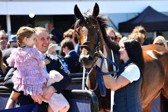 Watson with his daughter and the horse he part-owns, Annavisto, at Flemington in 2023. Tom Bellchambers and Cale Hooker are also part-owners.