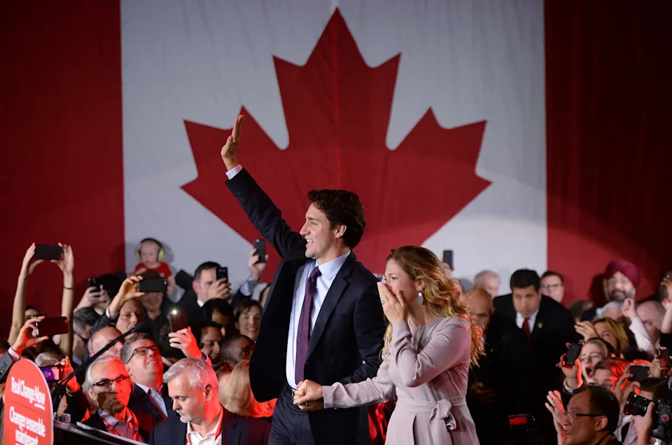 Liberal leader and incoming prime minister Justin Trudeau makes his way to the stage with wife Sophie Gregoire at Liberal party headquarters in Montreal early Tuesday, Oct. 20, 2015. THE CANADIAN PRESS/Sean Kilpatrick