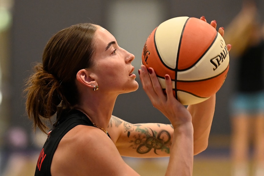 A close up of basketballer Anneli Maley as she prepares to shoot the ball.