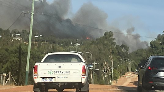 An out of control bushfire is threatening lives and homes in the Perth hills.