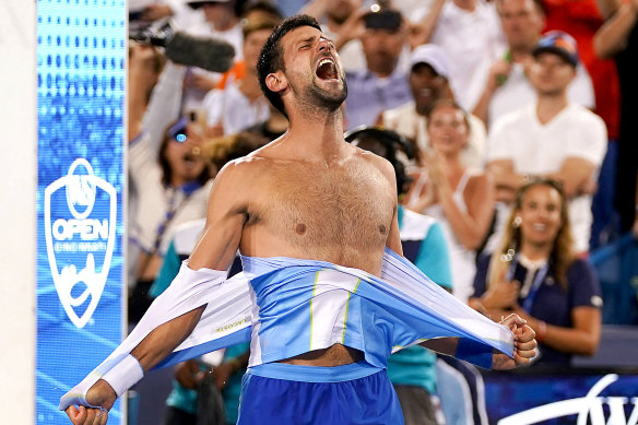 Novak Djokovic rips his shirt open after defeating Carlos Alcaraz at the 2023 Cincinnati Open.