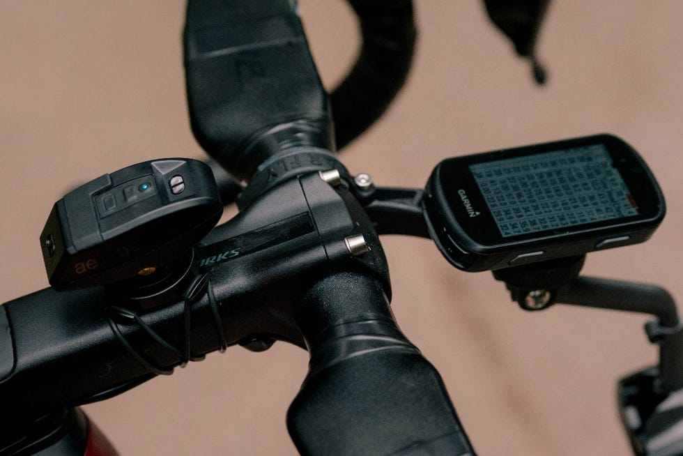 cycling handlebar with a gps device and a sensor attached