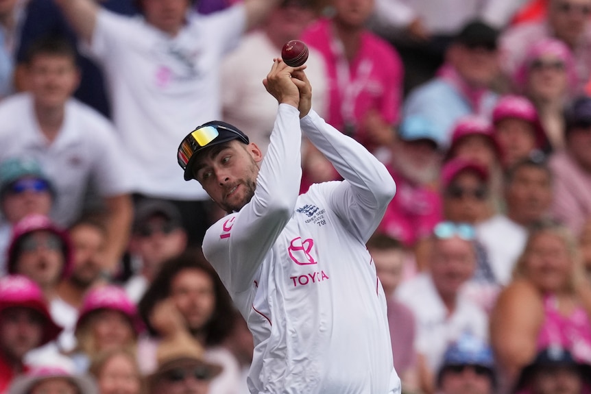 The cricket ball bounces off England fielder Will Jacks's hands during the SCG Ashes Test.