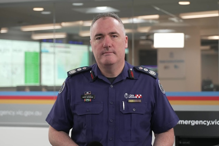 A man in a fire uniform.