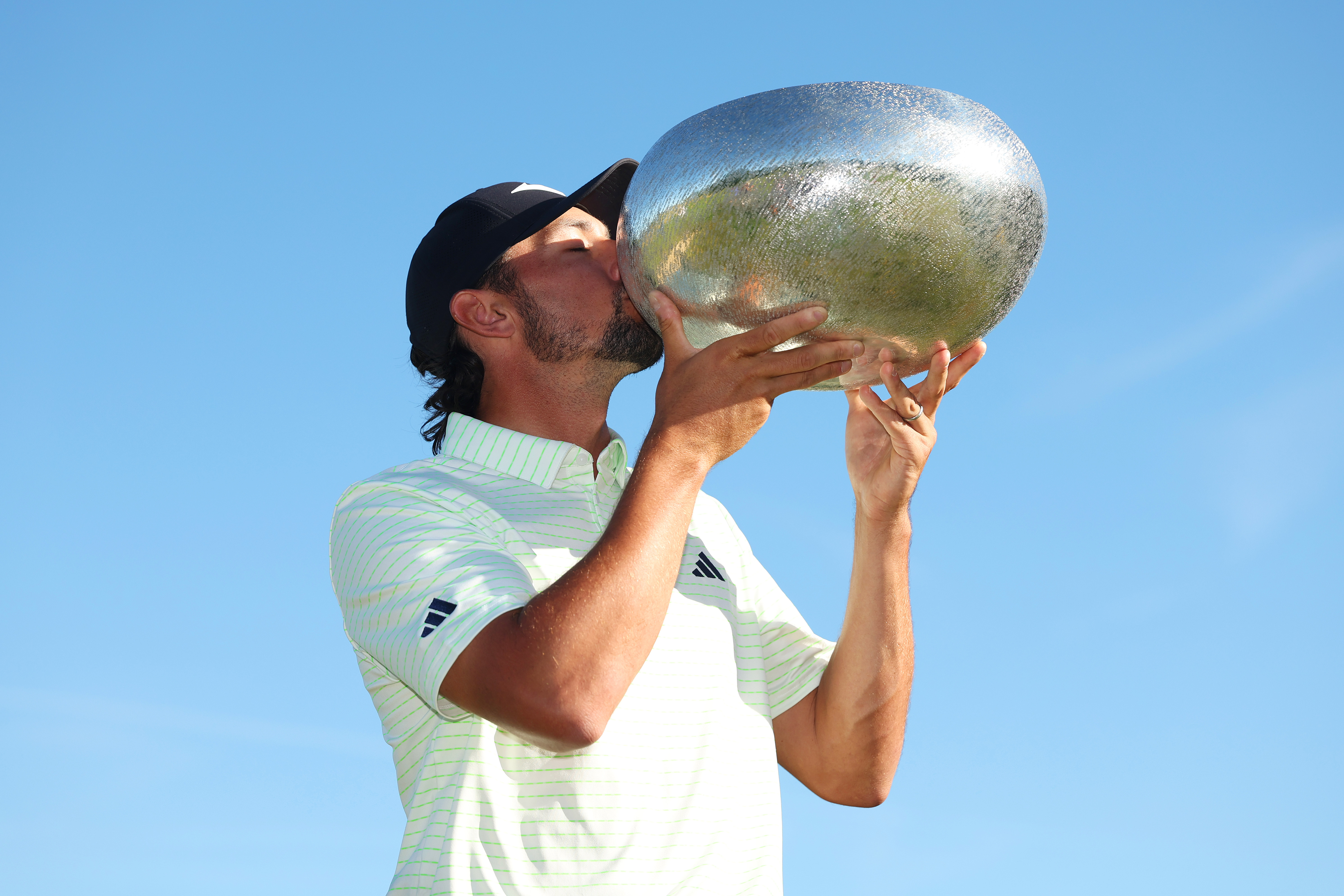 Marco Penge kisses a trophy