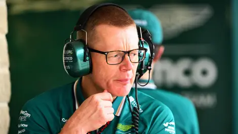 Team member in Aston Martin attire.