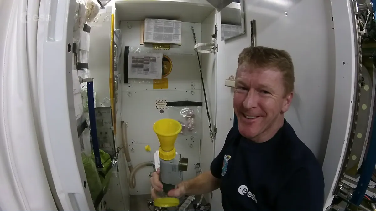 Tim Peake pictured with the toilet onboard the International Space Station. Credit: NASA/ESA