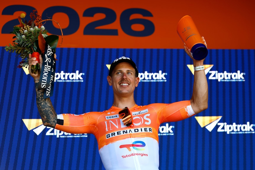 Sam Welsford holds up his hands