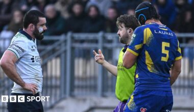 Referee Ben Whitehouse speaks to both captains
